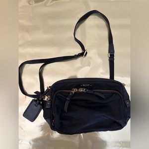 Tumi crossbody black and gold